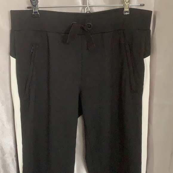 Athleta black joggers with white stripe down the side in excellent condition. - Picture 2 of 7